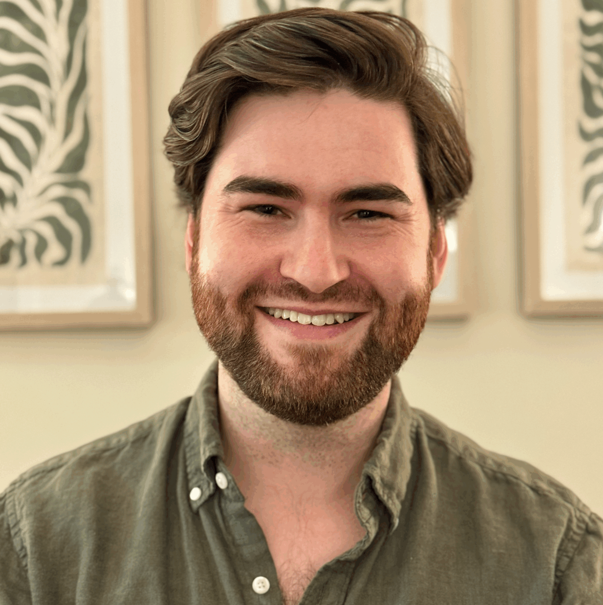 Person with beard wearing a green shirt